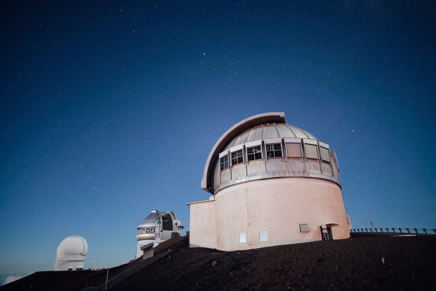 An observatory under a clear, star-filled night sky