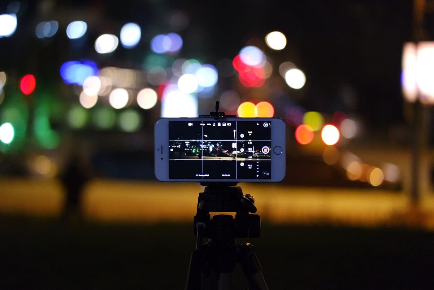 A night scene photographed on a smartphone with soft background lights