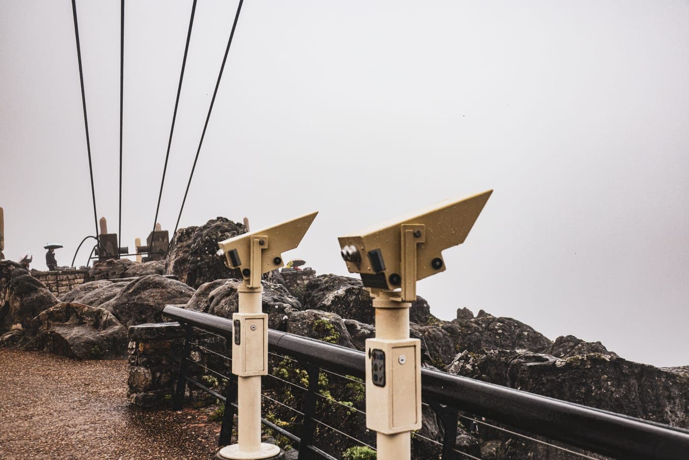 Mounted viewing scopes on a misty mountain overlook